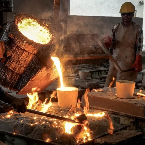 Molten iron being poured into moulds at a grey iron sand casting foundry